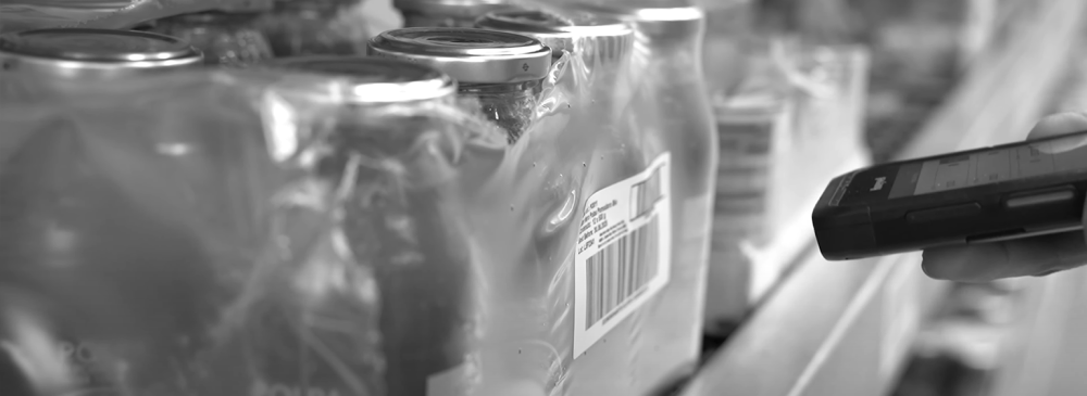 An Alce Nero operator scans the barcode of a food product to check its traceability