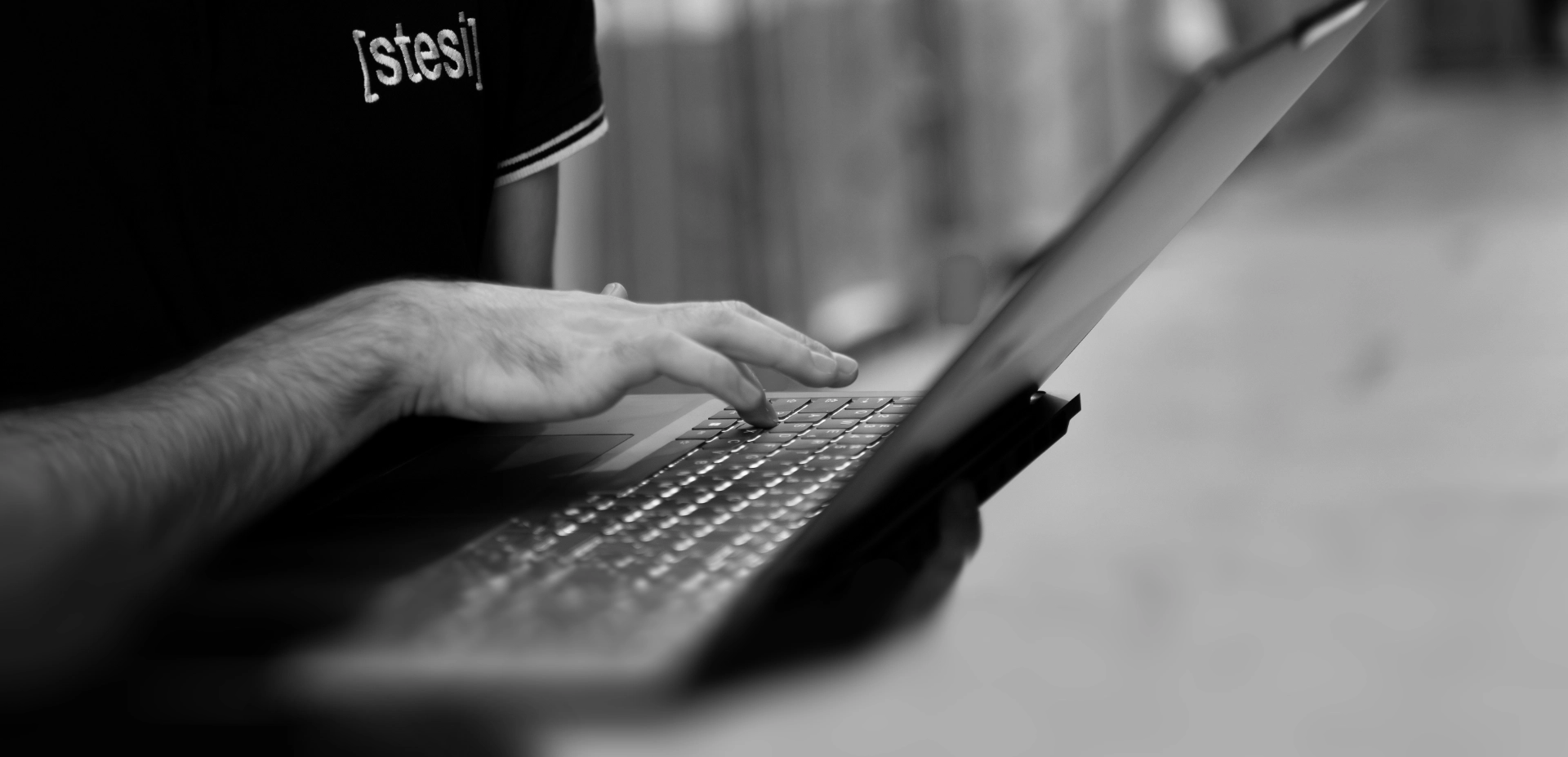 warehouse software developer works on the computer to optimize processes