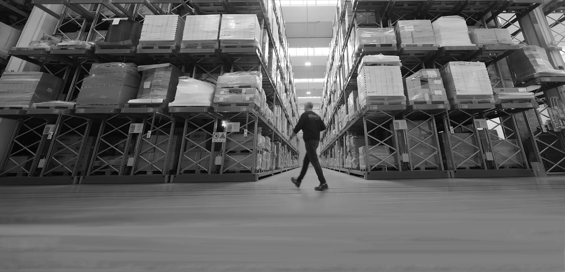 operator walks around the warehouse