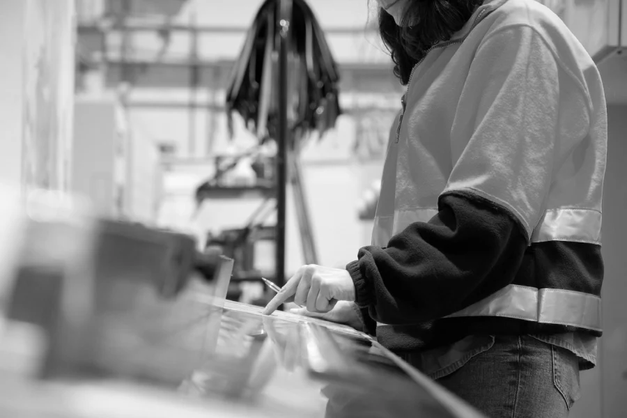 production management systems: a factory worker with MES software