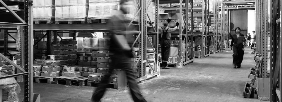How to design a modern warehouse: a warehouse operator walking through the aisles