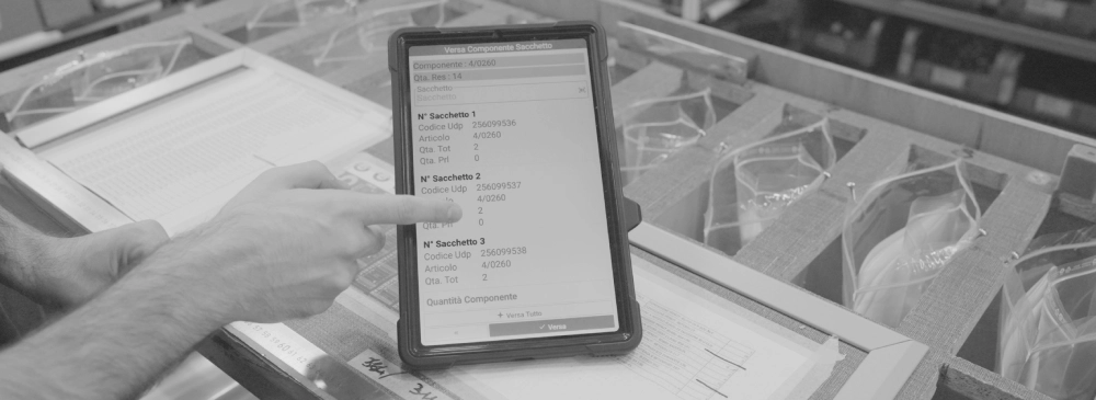 factory operator using MES software for lean manufacturing (component dispensing, bag number, UDP production unit code, item, total quantity, picking quantity, ...)